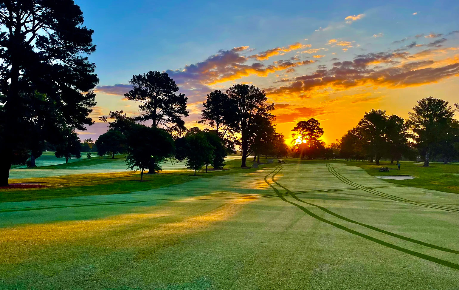  photo of an empty golf course at sunrise