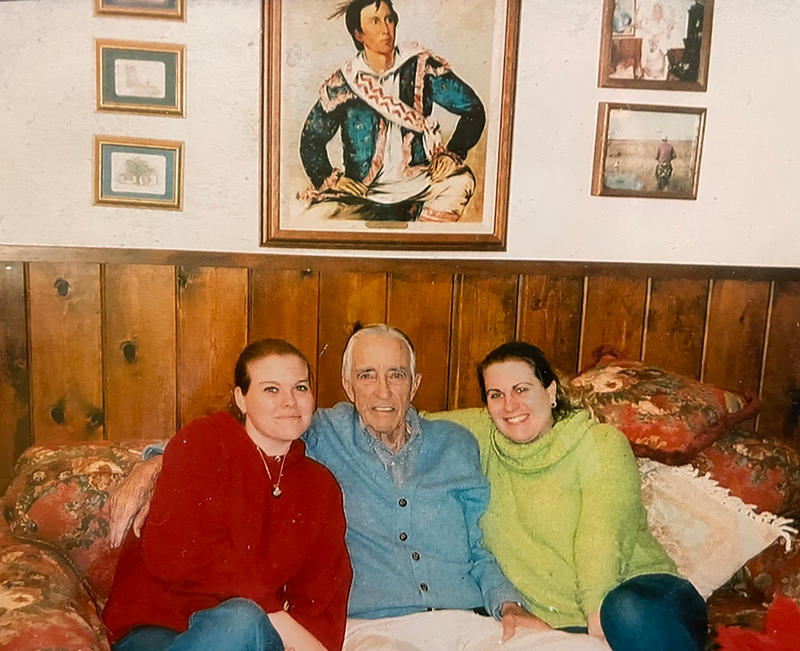 Professor Futrell (left) pictured with her grandfather (center) in front of a portrait of their relative, Peter Pitchlynn