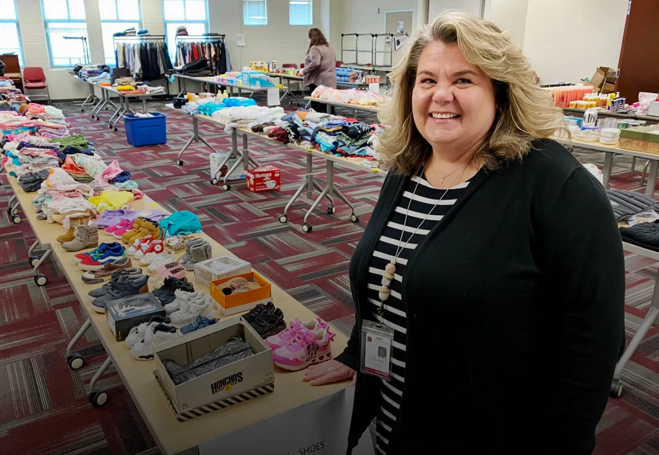 A staff member waits to help students attending Shop Day