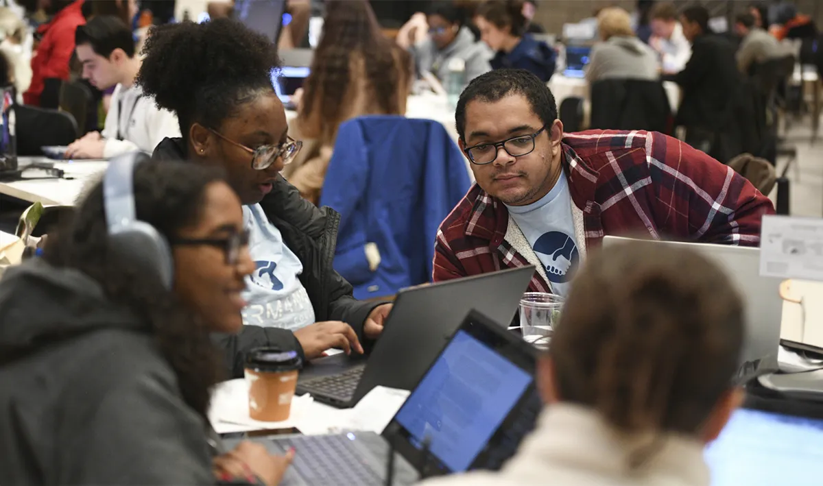 Students attend the CyberFusion hackathon