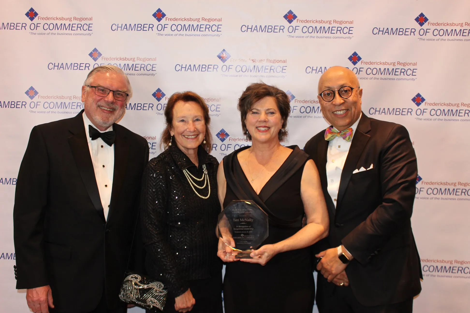 Teri McNally, (second from right) winning the Fredericksburg Chamber Prince B. Woodward Leadership Award