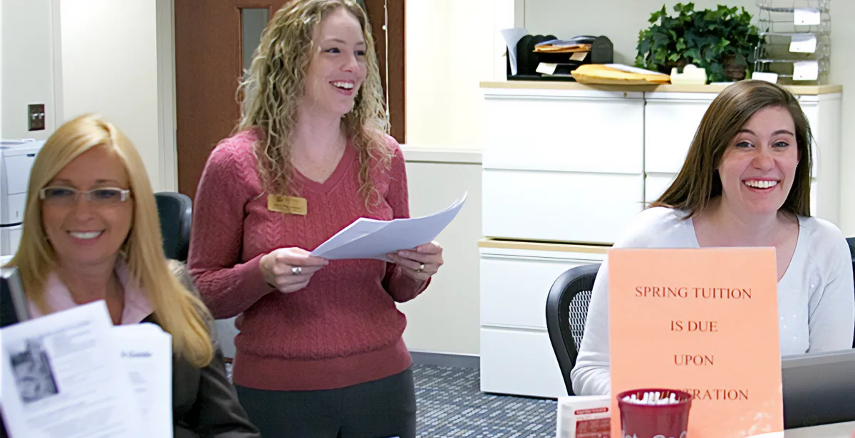 Anita Newhouse (center) at work at the Welcome Center