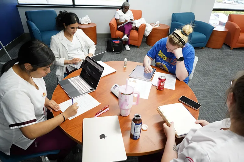 Students studying together in the lounge at the Stafford County Center