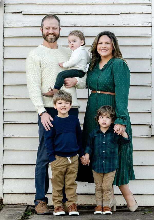 Dr. Nathan Schrenk shown with his wife and three sons