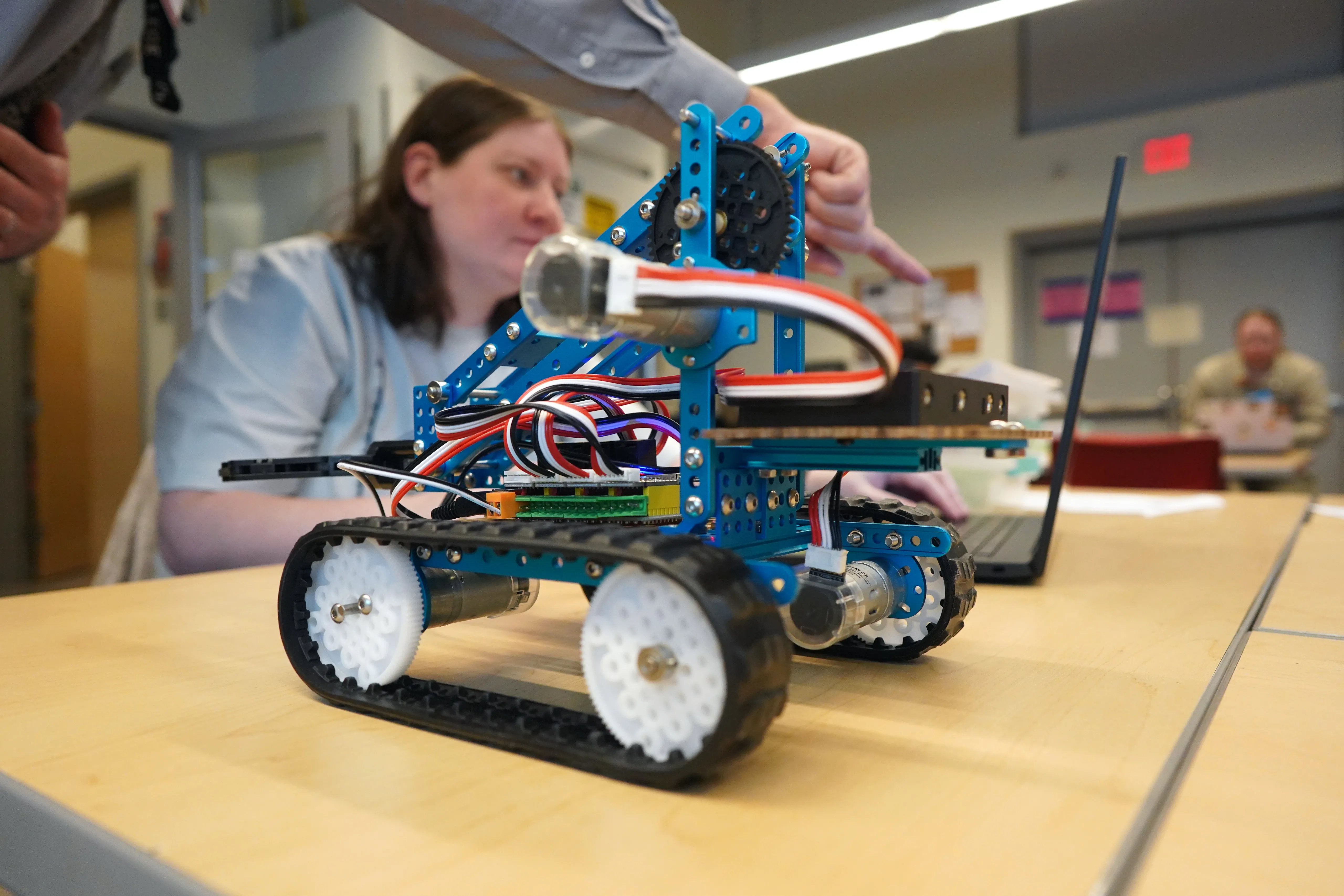 A close-up photo of a wheeled robot in a lab