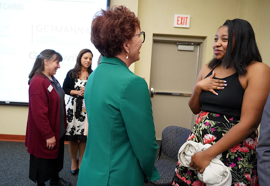 Student speaker Megan Collier (right) speaking to Dr. Gullickson at the conclusion of the event [Credit: Suzanne Rossi]