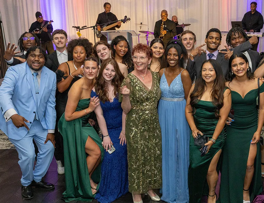Dr. Janet Gullickson (center) shown with Germanna students at the Germanna Gala [Credit: Bryant Cox]