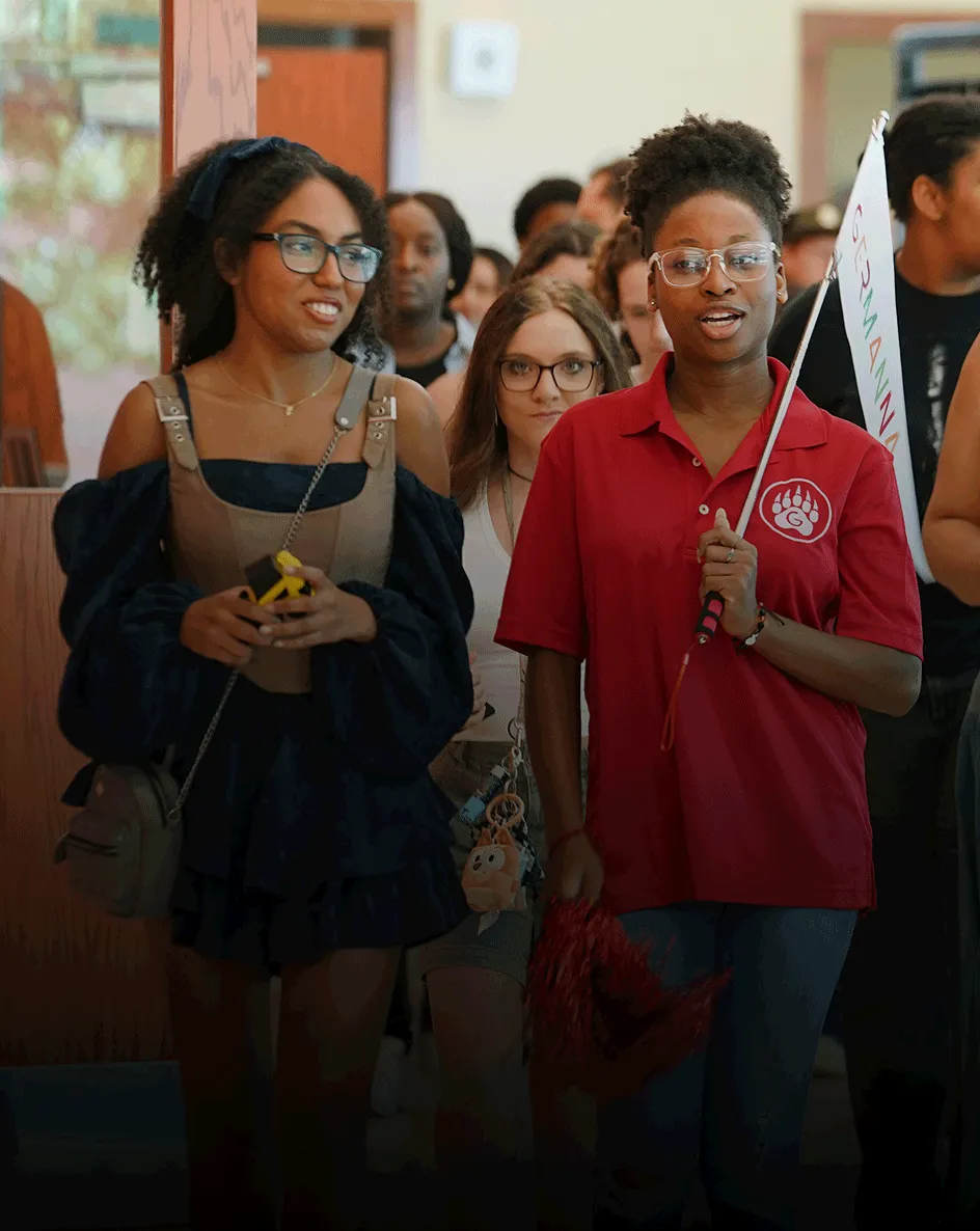 Students lead a tour at an open house