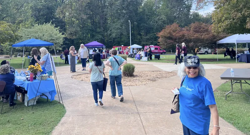 Prospective students and Germanna staff mill around outdoor tables during the Health Sciences Fall Festival