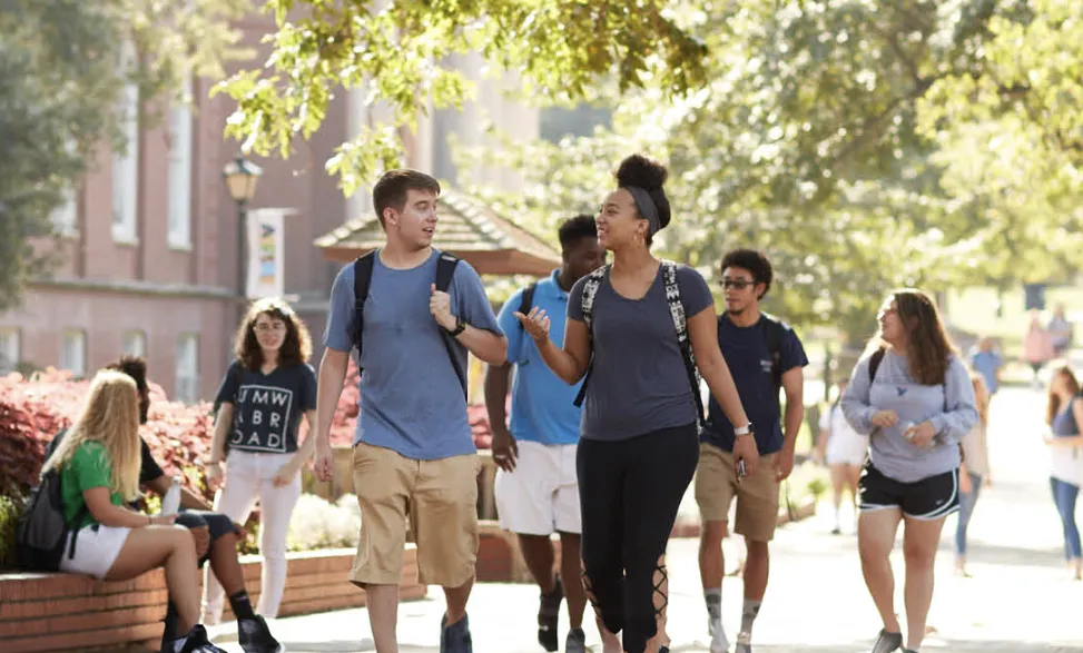 Students walking on campus on a sunny fall day