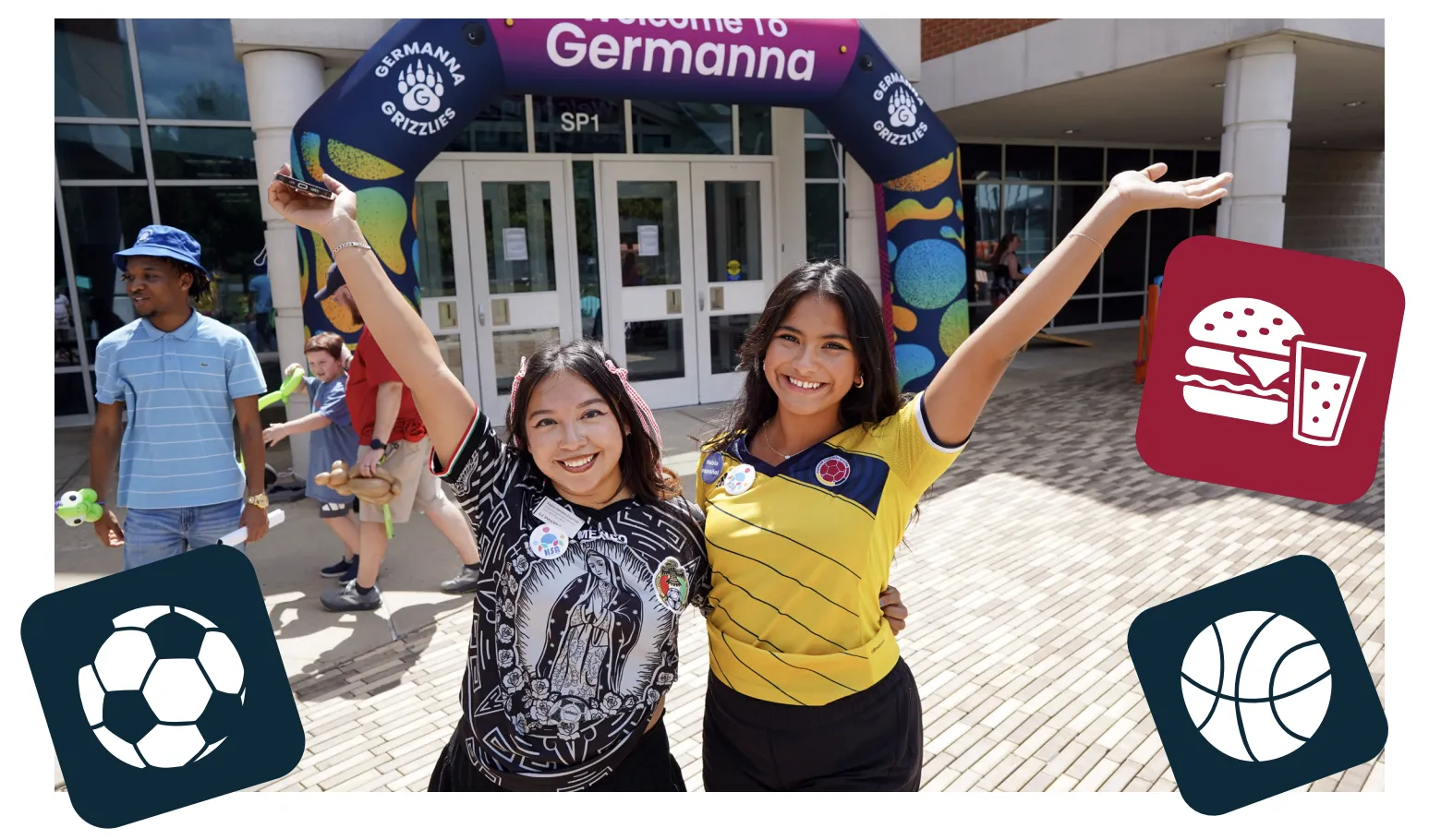 Two smiling young women with arms wrapped around each other and hands held up triumphantly