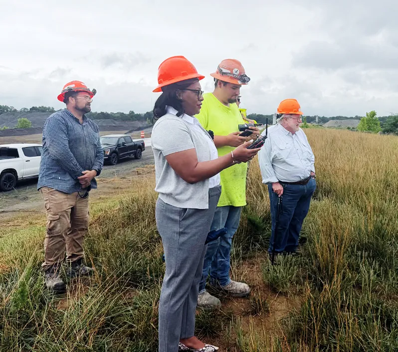 Germanna President Takisha Griffith, engineering student Merwin Thomas, and Cedar Mountain Stone President Ed Dalrymple ready for a quarry blast.