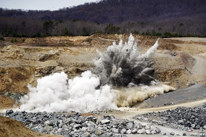 Explosives blast rock at the Cedar Mountain Stone quarry