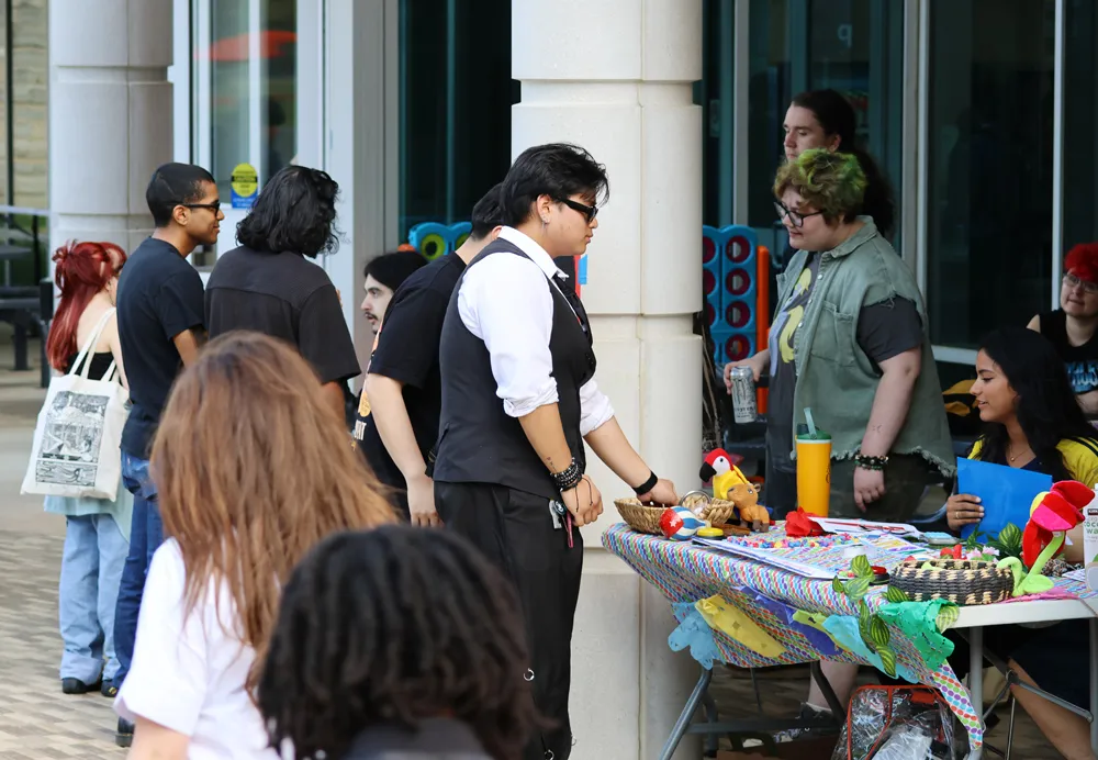 Students gather at a table on campus to learn about Germanna during Welcome Day