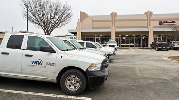 Trucks parked in front of the Fredericksburg Center for Advanced Technology