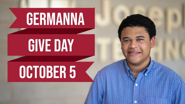 Germanna student next to the Germanna Give Day sign