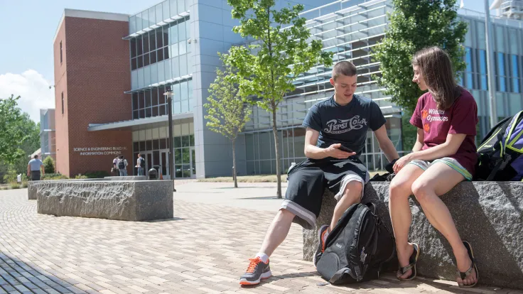 Two Germanna students in the courtyard at the Fredericksburg Area Campus