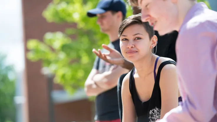 Germanna students sitting outside at the Fredericksburg Area Campus