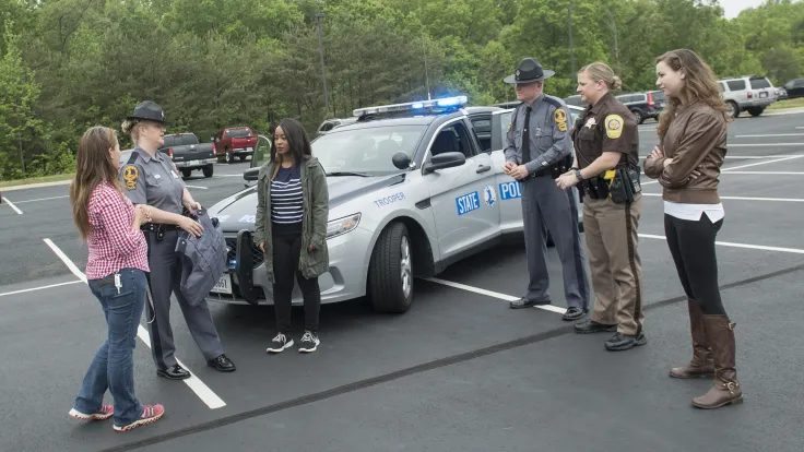 Law enforcement personnel working with students