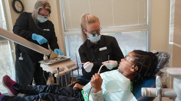 Dental hygienist at the Moss Clinic Give Kids a Smile Day