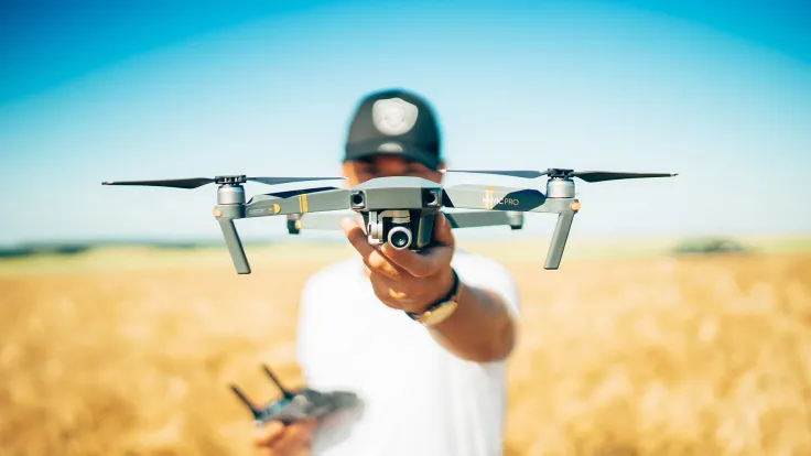 Man holding drone before flight