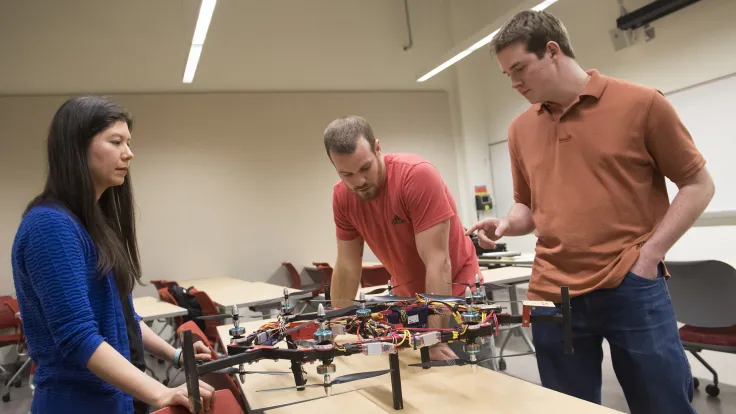 Students building drones in engineering class