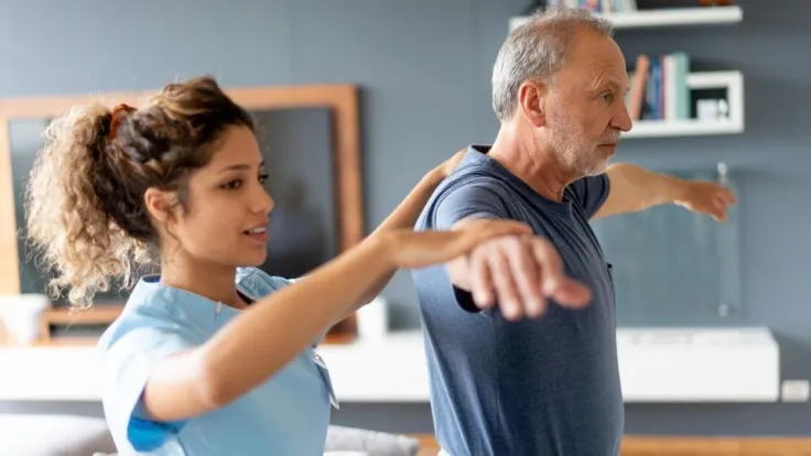 Physical Therapist Assistant and patient doing exercises