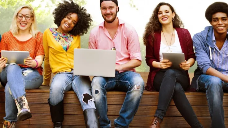 Happy Student Sitting on Wall