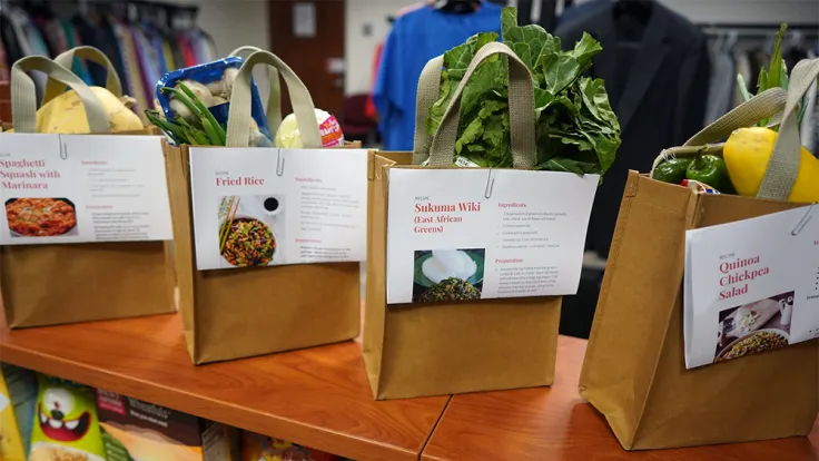 Some paper bags with dinner recipes