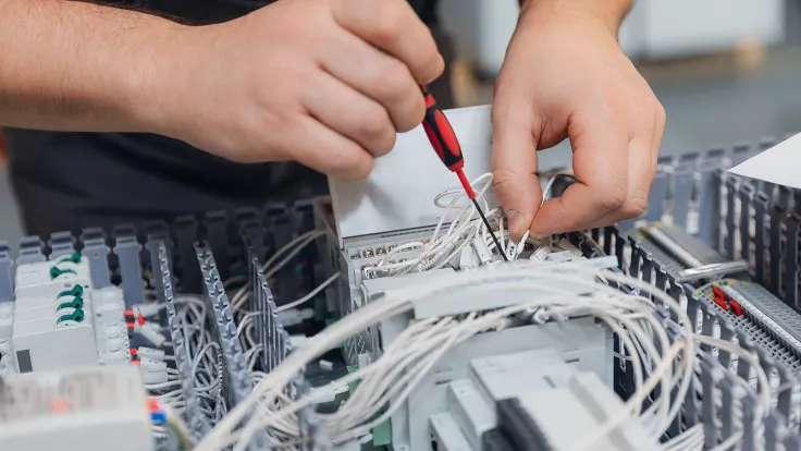 Closeup of an electrical engineering working on computer hardware